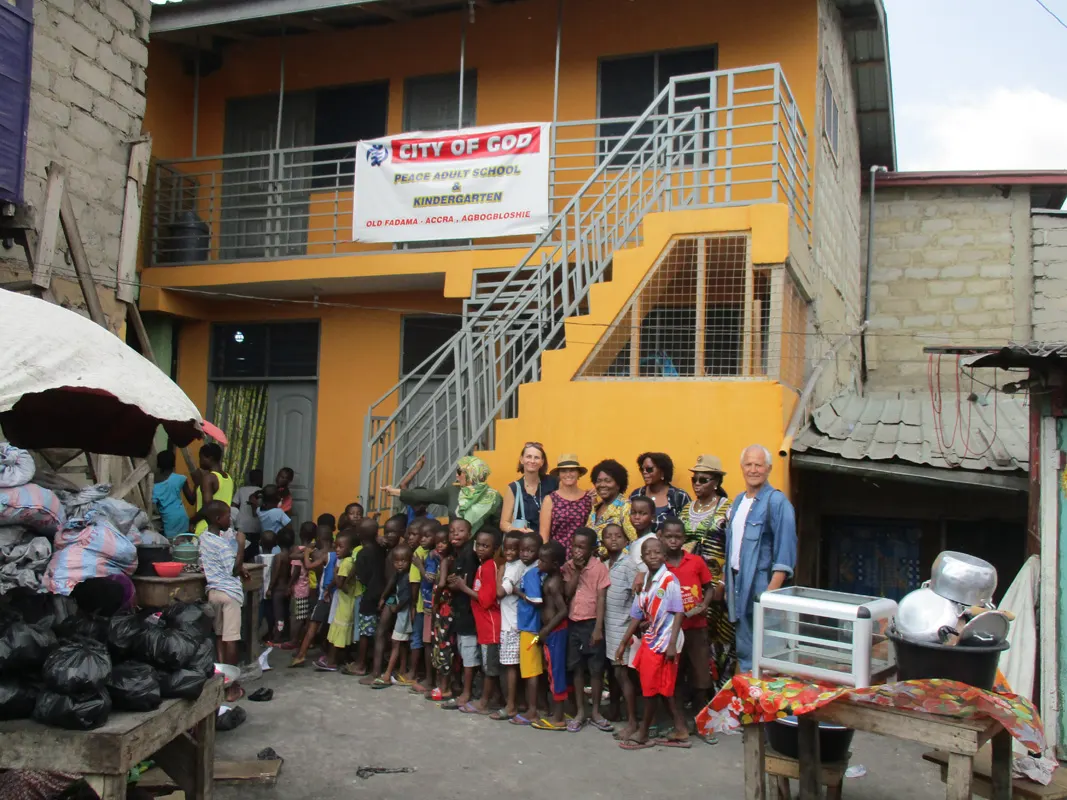 The City of God school building with its orange walls and outside staircase